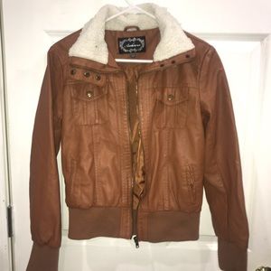 brown leather jacket with a soft fur collar